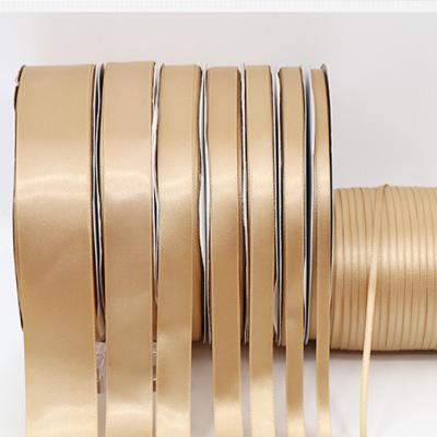 China High quality soft single side 100% polyester satin ribbon gold light gold stain luster IMEE double Logo Customized Personalized for sale