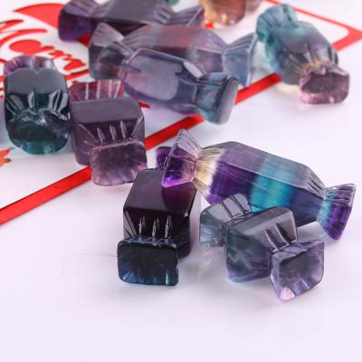 China Europe Hand Carved Crystal Figurines Polishing Rainbow Fluorite Carved Crystal Candy From Crystal Carvings for sale