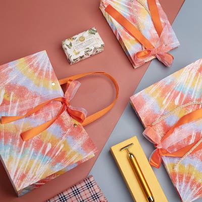 China Recycled Materials 2021 Wholesale Oil Painting Color Print Oranges Card Paper Bag White Potli Bags For Gifts for sale