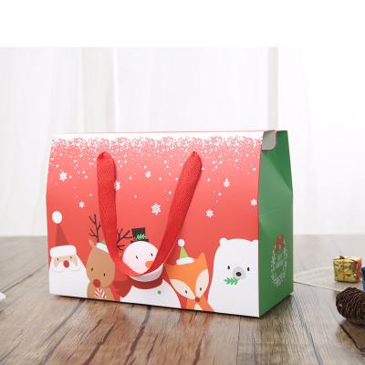 China Recycled Materials 2021 Wholesale Santa Claus And Elk New Design Candy Wrapping Christmas Paper Gift Bags With Handle for sale