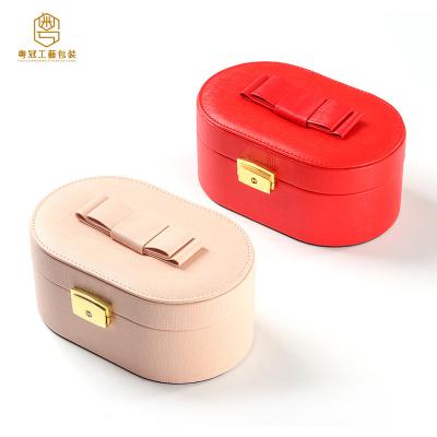 China PU Leather+Plastic+velvet+mirror OEM customized large capacity double-layer jewelry packing box with oval flip bow jewelry box gift box mirror for sale