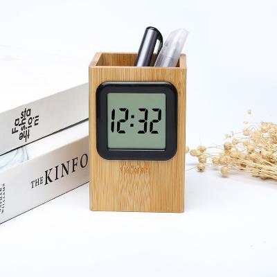 China Hot Selling OEM Plastic Silent Analog Discount Alarm Clock Bell Desk Table Morden Amazone Square Penholder Pen Holder Clock for sale