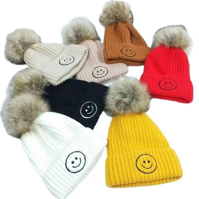 China Fashion\comfortable hat\2022 new baby goods with plush pompom and thick cute smiley face embroidery winter knitting hat for kids for sale