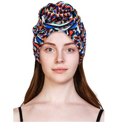 China New fashion women's cotton flower pre-tied cheap elastic bonnet chemo hat turban skull cap for sale