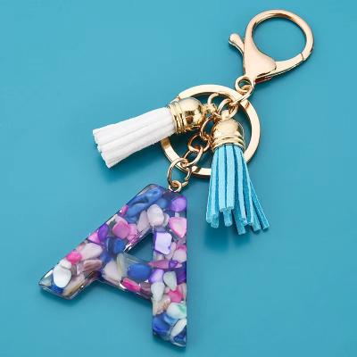 China Trendy Fashion Handbag Charm With Keychain Simple Acrylic Letters 26 Colors Tassel Key Chain for sale