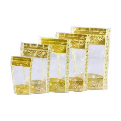 China Wholesale Custom Moisture Proof Printed Plastic Pouches Food Packaging Transparent Gold Patterned Ziplock Holder Up Pouches for sale