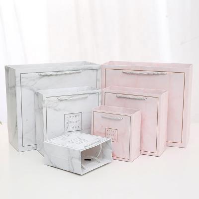 China Marble White Recycled Carrying Paper Bag Shopping Bag Card Materials Wedding Birthday Gift Pink Paper Clothing Bag Premium Custom Small Large for sale