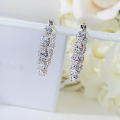 China 2021 New 5a CZ Ice Zircon Girl Women's Fashion Jewelry Oval Cut Diamond Huggie Circle Earring for sale