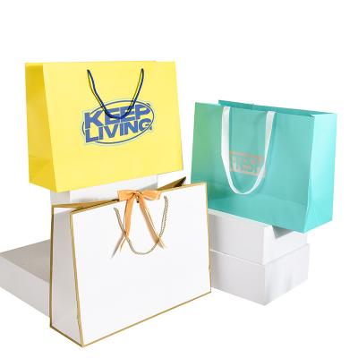 China Return refunds Custom Clothing Shopping Bags Gift Paper Bag Packaging with Handle Now for sale