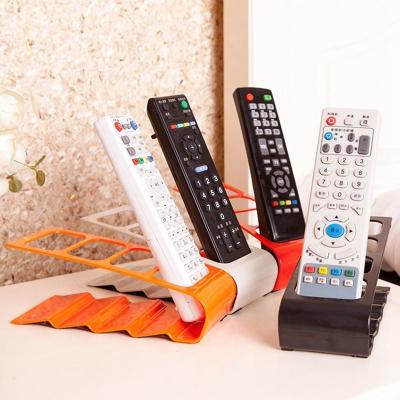 China Flexible 4 Grid Remote Control Storage Stretches Handy Random TV/DVD/VCR Organizer Remote Control Storage Mobile Phone Stand Holder for sale