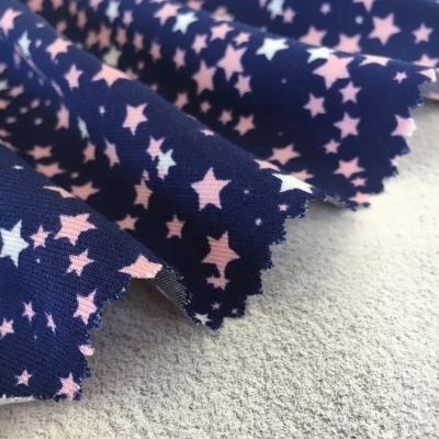 China New arrival popular dark blue star digital print 90 gsm 100% rayon lot stocks fabric en venta