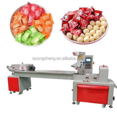 China Automatic Horizontal High Speed ​​Food Flow Wrap Sit Mini Small Sweet Candy Plastic Semi Seal Bag Hard Packing Machine for sale