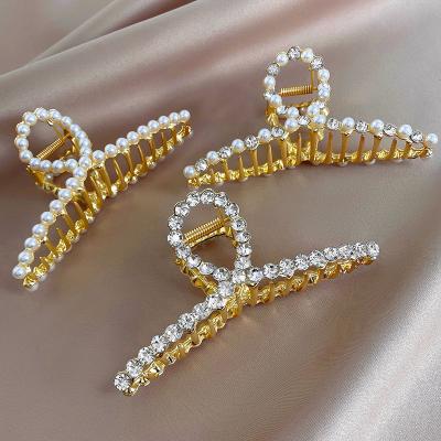 China Hair Holder Fashion Alloy Rhinestone Shark Clip Alloy Hair Spray Hair Claw Clip For Women Pearl Barrette for sale