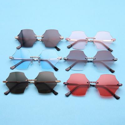 China High End Rimless Lens Sunglasses China Manufacturer Wholesale Fashion Sunglasses Women Gradient Sunglasses for sale