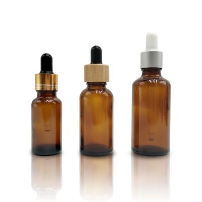 China Wholesale 5ml 10ml 15ml 20ml 30ml 50ml 100ml Amber Glass Essential Oil Eye Essence Dropper Cosmetic Bottle With Dropper And Cap for sale