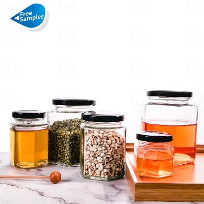 China Different Size Honey Jars Hexagon Clear Food Size Jam Sauce Storage Glass Bottle Storage Jars with Sealed Metal Lids for sale