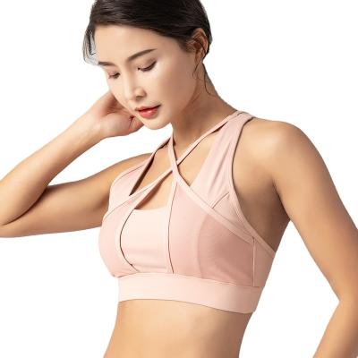 China 2020 new sports breathable bra yoga running vest for women with chest pads to fix straps polyester yoga bra 3/4 cup for sale