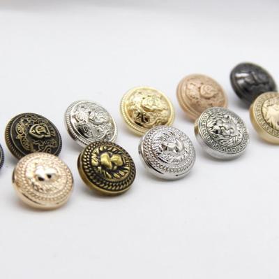 China Free Sample Wholesale Washable Fancy Type Custom Logo Gold Embossed Dome Metal Sewing Leg Buttons For Clothes for sale