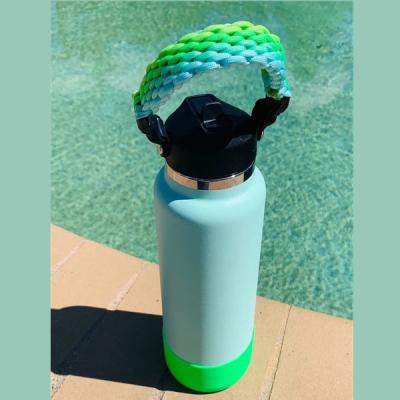 China Durable Summer Colorful Handwoven Bottle Holder Handle Strap Handwoven Water Bottle with Plastic Paracord Handle String Buckle for sale