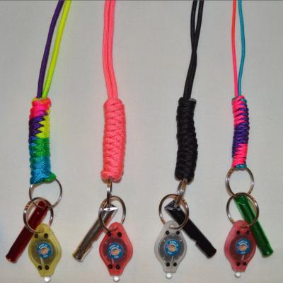 China 2022 Hot Selling Durable Colorful Paracord Necklace Designer Key Chain Lanyard Safety Colorful Chain Whistle With Mini LED Flashlight for sale