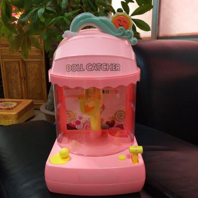 China Hot Selling Music Mini Coin Operate Rotary Game Doll Claw Machine Candy Catcher Machine For Kids for sale