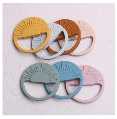 China Food Grade Soft Toy Wholesale Round Silicone Baby Teether Teether Ring Funny Toys Sun Rainbow Chew Toys Nurturing Hanging Chew for sale