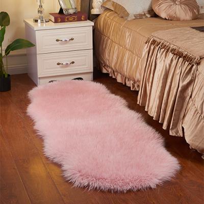 China Washable Fluffy Pink Artificial Sheepskin Bedside Faux Fur Blanket Rug for sale