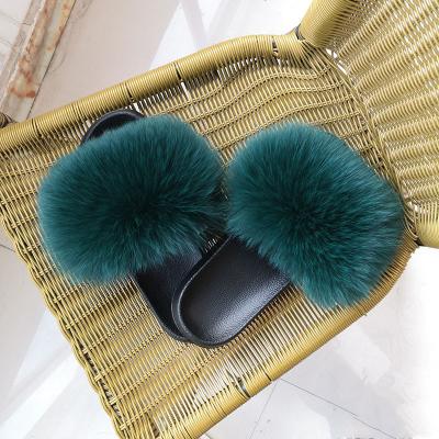 China Fashion Trend Wholesale Luxury Fur Slides Fox Raccoon Fur Slippers Fluffy Sandals Real Big Bulk Fur Home Slide For Women for sale