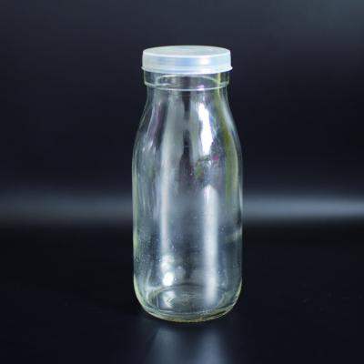 China 250ml Round Glass Beverage Glass Bottle Drink Bottle For Milk for sale