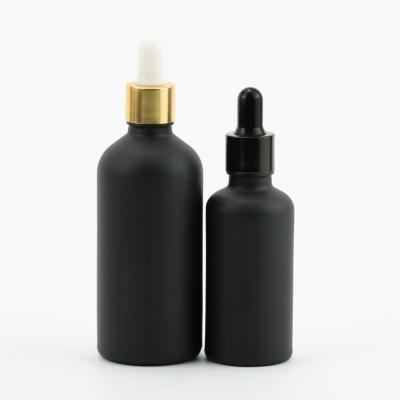 China Personal care in essential oil sale frosted matte black white glass dropper bottle with gold lid for sale