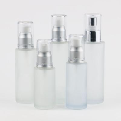 China 50ml 60ml 80ml 100ml 120ml Transparent Frosted Personal Care Cream Glass Bottles Cylinder Lotion Glass Bottles With Treatment Pump for sale