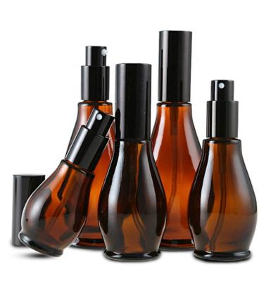 China Eco-Friendly Recyclable Single Gourd Amber Essence Oil Glass Bottles Empty Refillable for sale