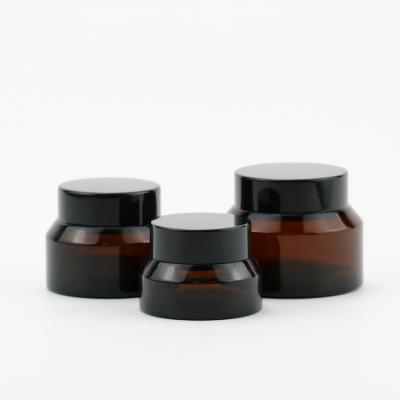 China Eco-friendly Recyclable Black Containers Cosmetics Makeup Creams Lotions Essential Oil Glass Bottle Jar for sale