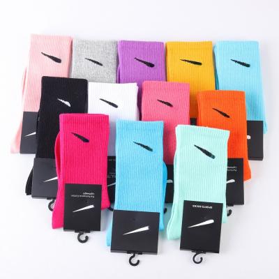 China 2022 sports new wholesale cheap thongs thin candy color cotton tube women branded graffiti luxury NK sports socks for sale