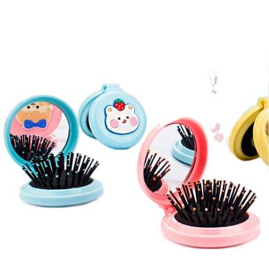 China Hot Selling Portable Folding Hair Comb New Small Soft Synthetic Hair Style With Mirror Candy Color Cute Air Cushion Comb For Women Hair Accessories for sale