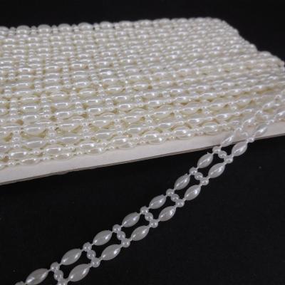 China Fashionable Hot Selling Beads ABS Pearl White 4*8mm Rice Shape Plastic Beads For Wedding Apparel Accessories for sale