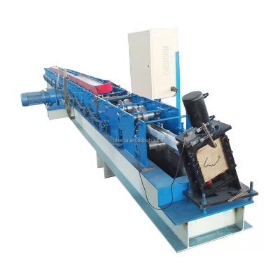 China Hotels Galvanized Rolling Door Frame Forming Machine With Punch Hole for sale