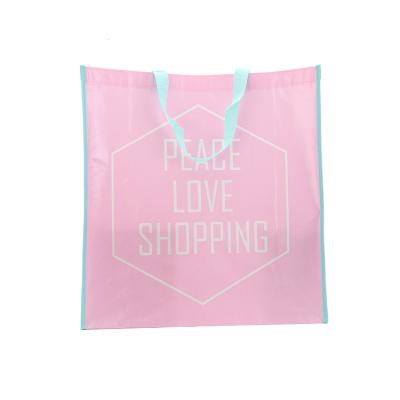 China 2022 factory sales high quality cheap cute handled non woven pink shopping bag with blue handle for sale