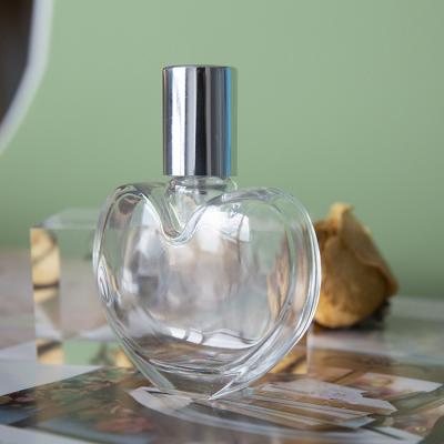 China Personal Care New Design Heart Shape Perfume Bottle , Transparent Clear High End Spray Perfume Bottles Glass# for sale