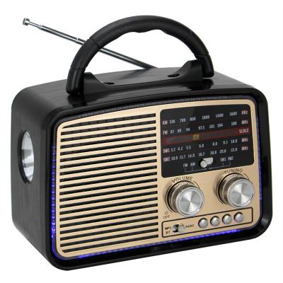 China Newest Puxing 2022 PORTABLE PORTABLE retro radio 931BT am fm switch 3 band torch radio with disco light for sale