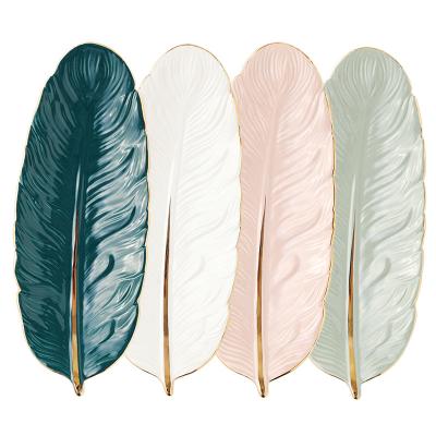 China Contemporary Nordic luxury desktop decorative feather shaped dish ceramic plate home decoration for sale