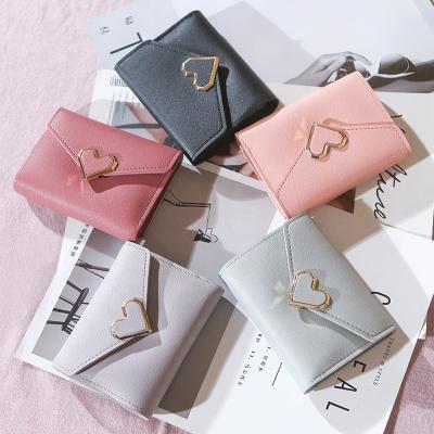 China 2020 New Style Ladies Waterproof Wallet With Metal Heart Latch Three Card Holder Times Purse For Women for sale