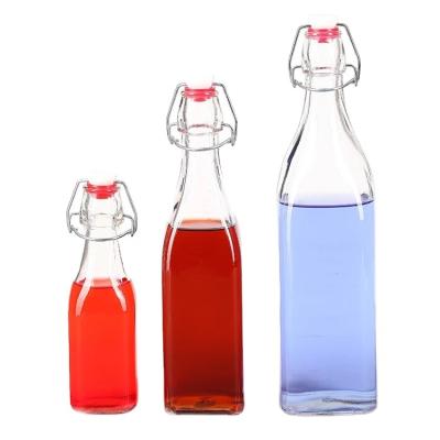 China Beverage 500ml Round Square Swing Top Grolsch Glass Bottles CLEAR 16oz For Brewing Kombucha Kefir Beer for sale