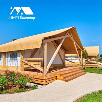 China Safari Tents Supplier Beach Tent Poles Large House Glamping Wooden Resort Camp Tent Luxury Hotel Waterproof Outdoor Ready Made Project for sale