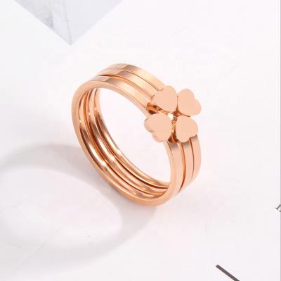 China Aizhilin Environmentally Friendly Three In One Combination Four Leaf Clover Pated Steel Rose Gold Peach Heart Ring for sale