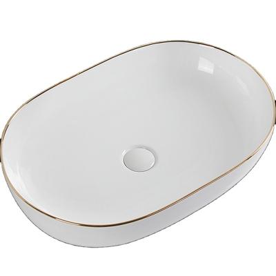 China Factory supplier modern bathroom sink basin oavl countertop ceramic with high heat fired gold line. welcome to inquiry for sale