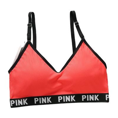 China Seamless Knitted Sexy Gym Women Boobs Sports Bra Teenagers Professional One-Piece Full Cup Design for sale