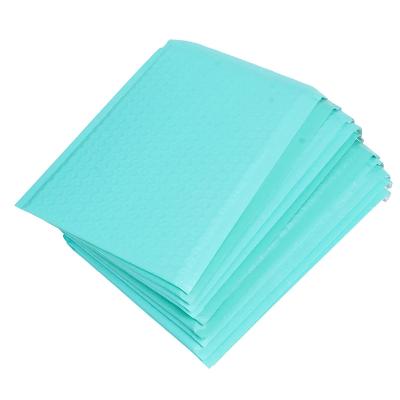 China Large Strong Adhesive Capacity Matte Process Strength Printed Packaging Matte Padded Poly Bubble Mailers cyan for sale