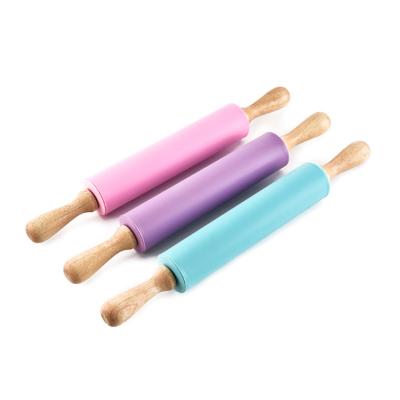 China Viable Kitchen Non-Stick Home Silicone Rolling Pin With Wooden Handle for sale