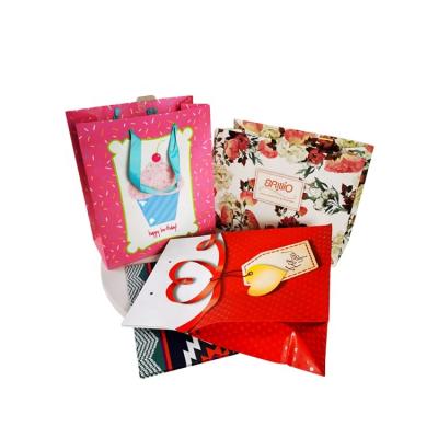 China Luxury Custom Recycled Paper Packaging Giftbag Packaging Materials Boutique Christmas Gift Shopping Bags for Festival and Birthday Party for sale